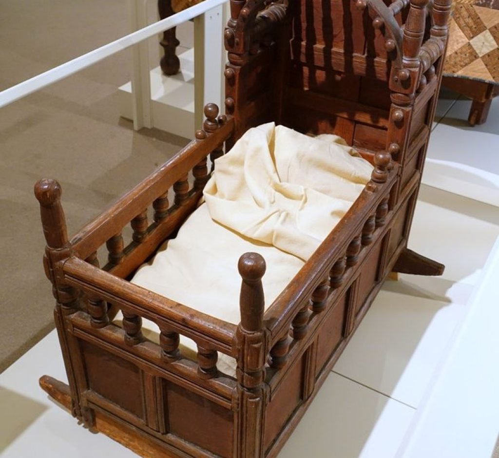 Baby's cradle, a common piece of furniture found in most Colonial-era homes. Credits: https://owlcation.com/humanities/early-american-furniture-17th-18th-century-furniture